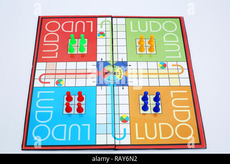 Picture of colorful tokens and dice on the ludo. Stock Photo