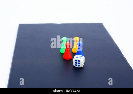 Picture of ludo tokens and dice on the board game. Stock Photo
