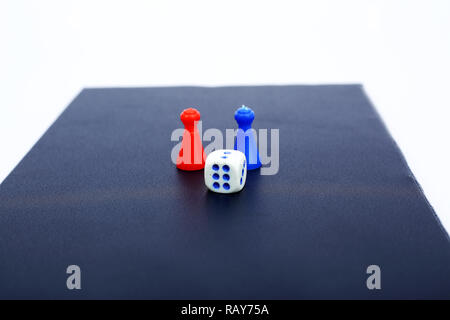 Picture of Dice and tokens on the ludo board game. Stock Photo