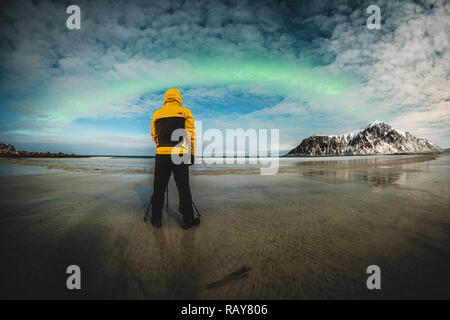 The photographer takes photo under the northern lights. Stock Photo