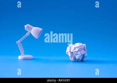 Ideas and creativity concepts with paper crumpled ball and lamp.Business solution. Stock Photo