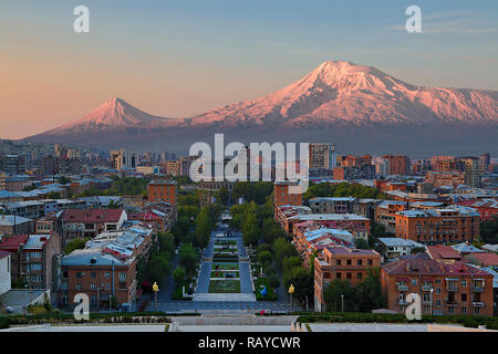 View over the city of Yerevan, capital of Armenia, with the two peaks of the Mount Ararat in the background, at the sunrise Stock Photo