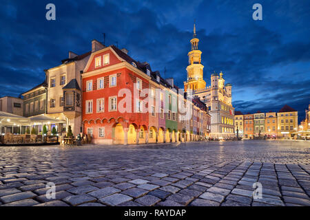 Stary Rynek square with small colorful houses and old Town Hall at dusk in Poznan, Poland Stock Photo