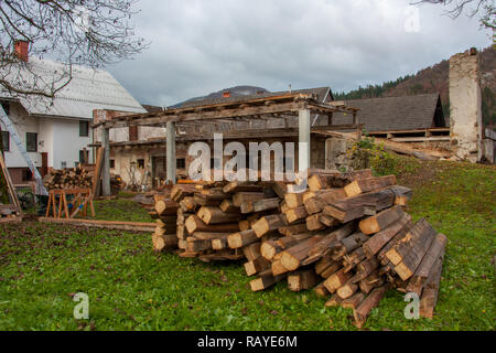 beams behind half destroyed barn Stock Photo