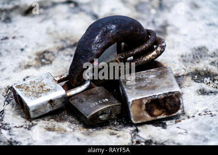 Rusty padlocks abandoned on the pier lisbon Stock Photo
