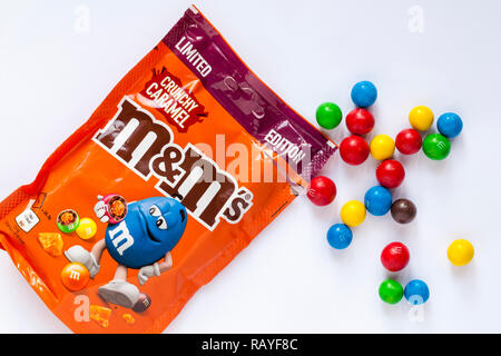 Packet of limited edition crunchy caramel M&Ms isolated on white background  Stock Photo - Alamy