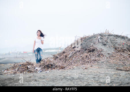 Asian female model poses for pictures on the street Stock Photo