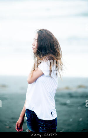 Asian female model poses for pictures on the street Stock Photo