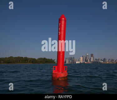 Bouy boat ship marker in Lake Ontario at Cherry Beach in Toronto Canada against a cityscape of Downtown Toronto, Ontario, Canada. Stock Photo