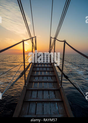 Sunset at the Sailboat deck while cruising in the Cyclades in Greece Stock Photo