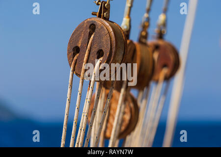 Old ship tackles. Old sailing ship vessel. Background Stock Photo