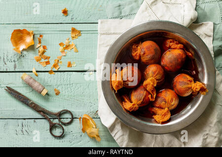 Eggs with a pattern onion peels. Preparation of Easter eggs for dying with onion peels. Stock Photo