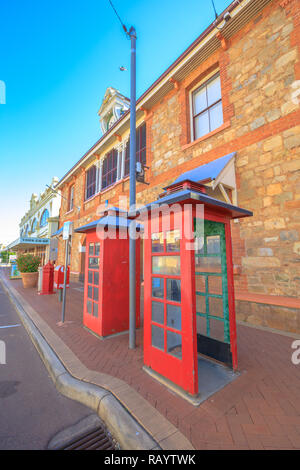 York, Australia - Dec 25, 2017: two vintage red telephone box in front of York Post Office built in 1893, York, a popular tourist and historic town east of Perth. The first inland settlement in WA. Stock Photo