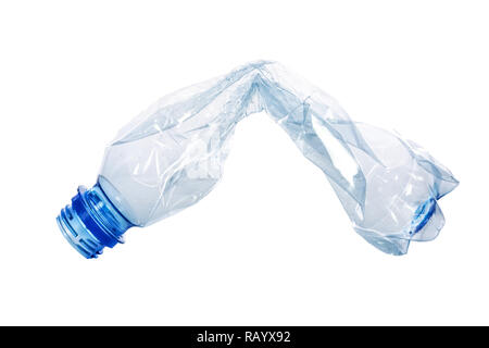 Single crumpled plastic blue bottle isolated on a white background in close-up Stock Photo