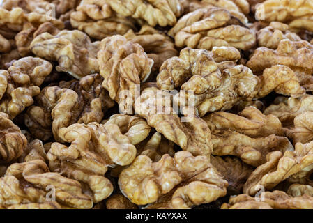 Background of shelled dried walnuts in close-up (high details) Stock Photo