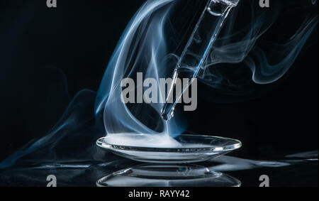 chemical reaction: fog with ammonia and muriatic acid Stock Photo