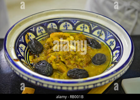 tajine with meat plum almond and sesame seeds Stock Photo