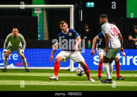 Glasgow, UK. 5th Jan 2019. Action from Day 2 of the FansBet Star Sixes Tournament at the SSE Hydro in Glasgow.   Game 6 - England Vs Scotland Darren Bent looking for a route to goal against the Auld Enemy during the Star Sixes Tournament in Glasgow Credit: Colin Poultney/Alamy Live News Stock Photo