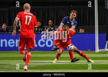 Glasgow, UK. 5th Jan 2019. Action from Day 2 of the FansBet Star Sixes Tournament at the SSE Hydro in Glasgow.    Game 2 - Wales Vs Scotland Wales David Cotterill looks on as his team mate Jermaine Easter gets flattened by Scotland's Mark Burchill during the Star Sixes Tournament in Glasgow Credit: Colin Poultney/Alamy Live News Stock Photo