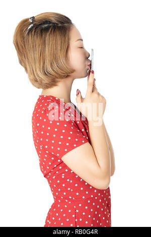 Chinese business woman holding a small tablet computer isolated on a white background Stock Photo