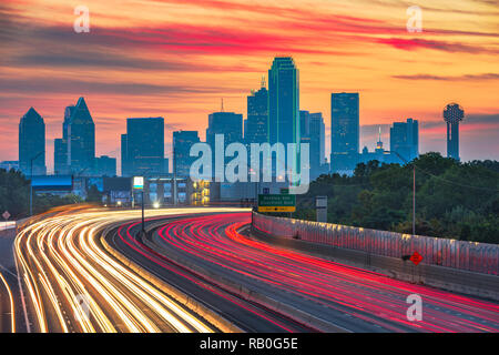 Dallas, Texas, USA downtown skyline and highway at dawn. Stock Photo