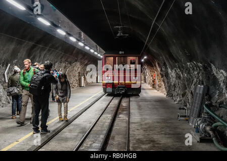 Jungfrau, Switzerland - Oct 20, 2018. Tourist train stopping at Jungfraujoch Station (Switzerland). Stock Photo