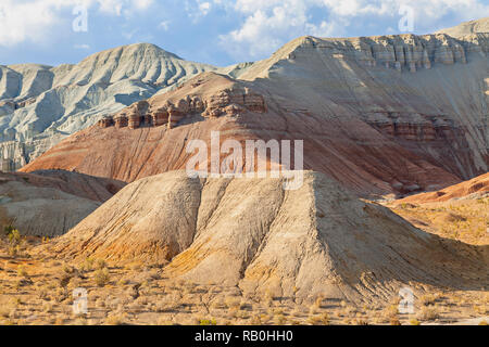 Rock formations and extreme terrain in the Aktau Mountains known also as White Mountains, in Kazakhstan Stock Photo