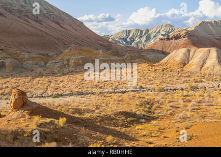 Rock formations and extreme terrain in the Aktau Mountains known also as White Mountains, in Kazakhstan Stock Photo