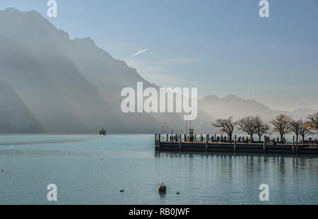 Swiss lake at sunset in Brienz, Switzerland. The turquoise Lake Brienz is set amid the spectacular mountain scenery. Stock Photo