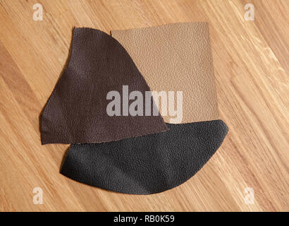 leather samples on wooden background, close up Stock Photo