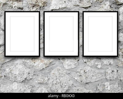 Three blank black picture frames on gray   concrete wall background Stock Photo