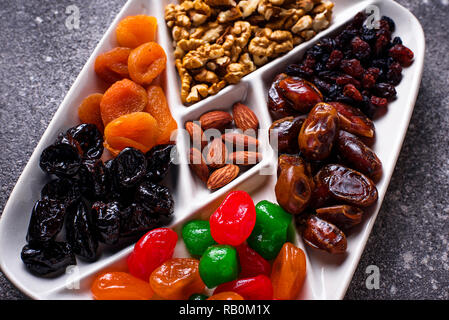 Mix of dried fruits and nuts in plate Stock Photo