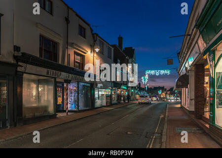 EAST GRINSTEAD, WEST SUSSEX/UK - JANUARY 4  : View of the town centre at night in East Grinstead on January 4, 2019. Three unidentified people Stock Photo
