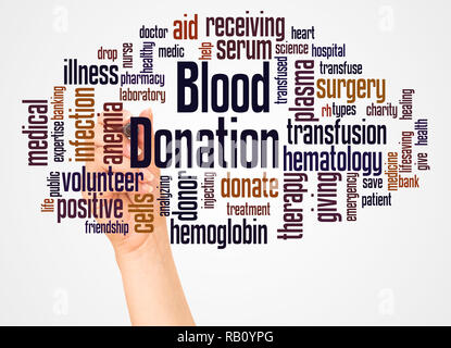 Blood donation word cloud and hand with marker concept on white background. Stock Photo