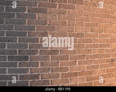 Curved grey brick wall texture with light gradient. Stock Photo