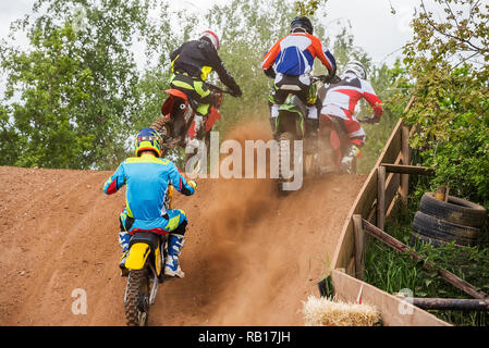 motocross racer jumping on the track Stock Photo