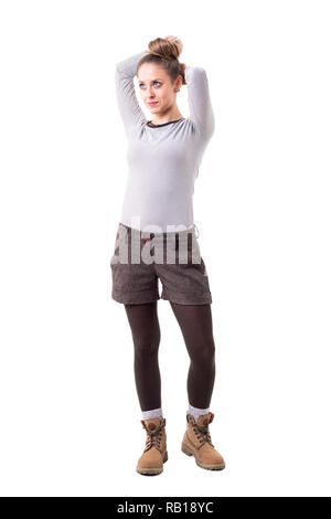 Daydreaming beautiful young woman in hipster style clothing looking up.  Full body isolated on white background Stock Photo - Alamy