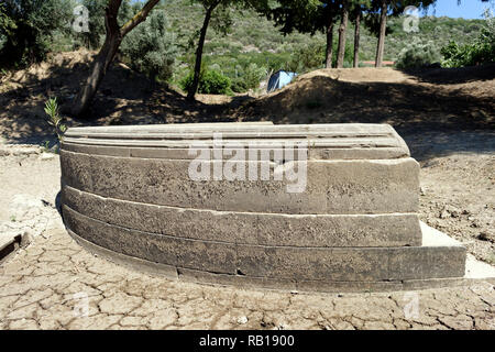 Ancient Greek inscriptions cover the sides and rear of the Exedra at the ancient Greek sanctuary of Apollo of Claros, Izmir province, Turkey.  The Exe Stock Photo