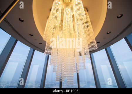 DUBAI, UAE - October, 2018: Illuminated Chandeliers inside the observation deck the top Burj Khalifa Stock Photo