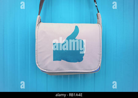 Like symbol on a bag with a hand giving the thumbs up sign. Stock Photo