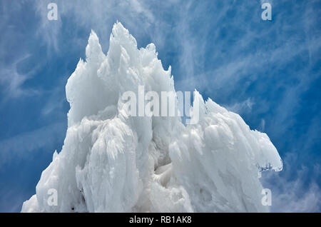 Ice formations against the sky, abstract winter background. Stock Photo