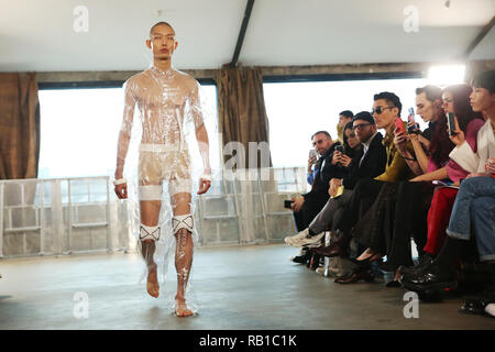 Models on the catwalk during the Xander Zhou at London Fashion