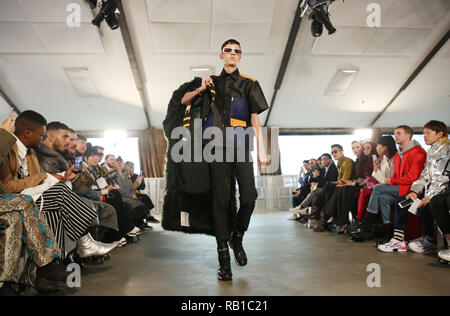 Models on the catwalk during the Xander Zhou at London Fashion