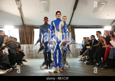 Models on the catwalk during the Xander Zhou at London Fashion