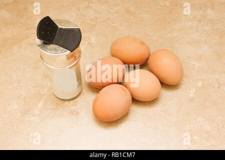 five chicken eggs lie on the table Stock Photo