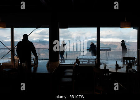 Tourists in and out restaurant admiring view Stock Photo