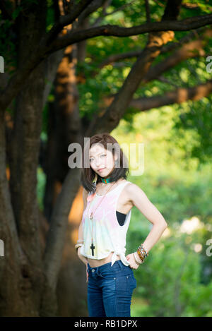 Asian female model poses for pictures on the street Stock Photo