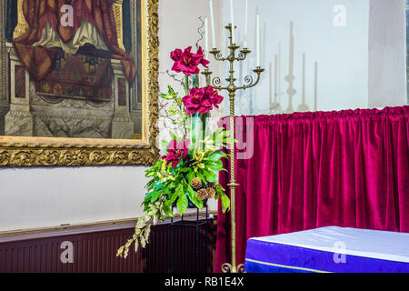 Christmas flower display at All Saints Church in East Budleigh. Stock Photo