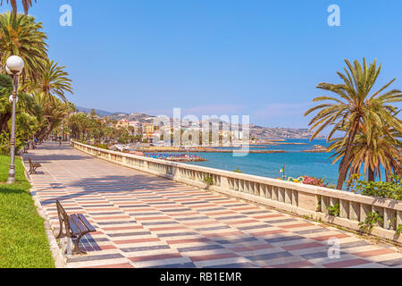 San Remo, Italy – June 24, 2018: Corso dell'Imperatrice pedestrian promende street in San Remo with wiew of the beach and city panorama. Stock Photo