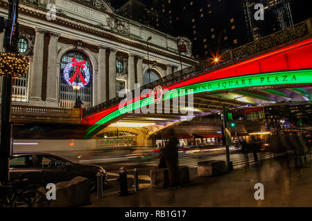 NEW YORK, NY, USA - DECEMBER 27, 2018: Beautiful evenings with street lights near Grand Central Terminal with Chrysler building in back. Stock Photo